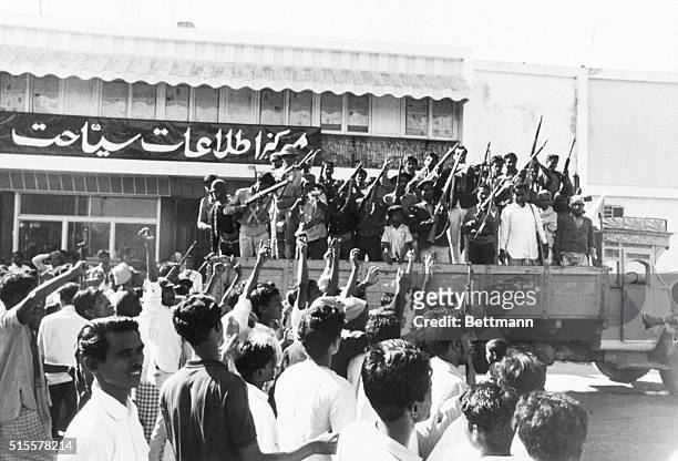 Crowd cheers a truckload of pro-independence Mukti Bahini guerrillas two days after the Pakistani surrender at the end of the Bangladesh War of...