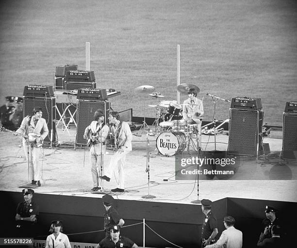 New York: That's them. The Beatles. They're here. In New York. What are they doing? Entertaining Fans. Where? At Shea Stadium. Why? Because those...