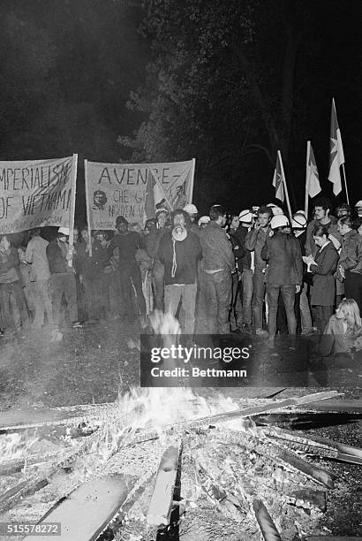 Tom Hayden, one of eight men on trial for conspiracy to incite riots druing the 1968 Democratic Party national convention uses a loud-speaker to talk...