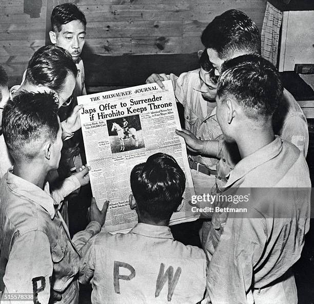 Sept.1945-Camp McCoy, WIS.: Japanese prisoners of war read newspaper announcing impending surrender of Japan. This is first photo showing Japanese...