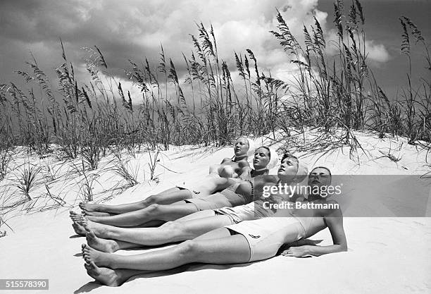 St. Petersburg, Florida: These daughters of the Old South try out an old southern custom. When summer comes they pack up their bathingsuits and head...