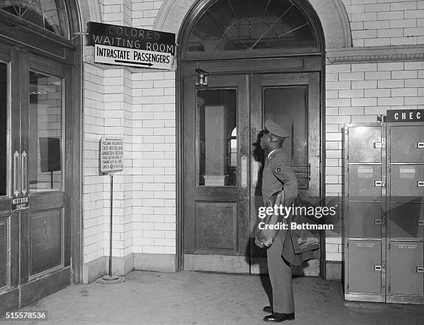 Atlanta, GA: Airman Second Class Philip Wagner, of New York City, en route to the Warner Robbins Air Force Base Near Macon, GA, pauses to examine the...