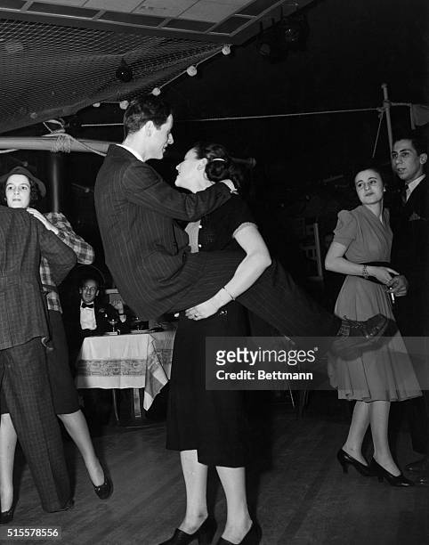 New York, NY: Jitterbugs taking over the floor at the Yacht Club in New York City, ca. 1938.