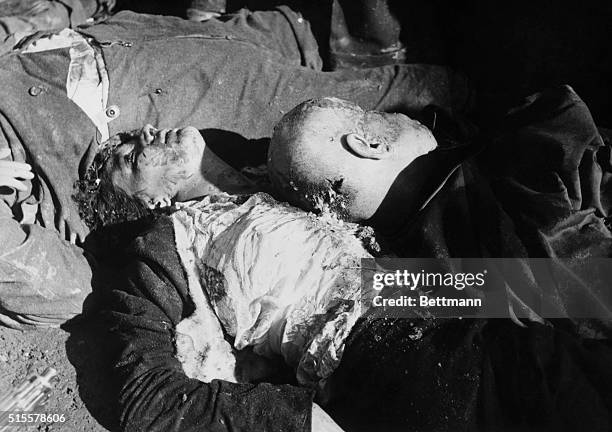 The bodies of Benito Mussolini and his mistress, Claretta Petacci, lying with other Fascists in the Loreto Square, Milan, 1945.