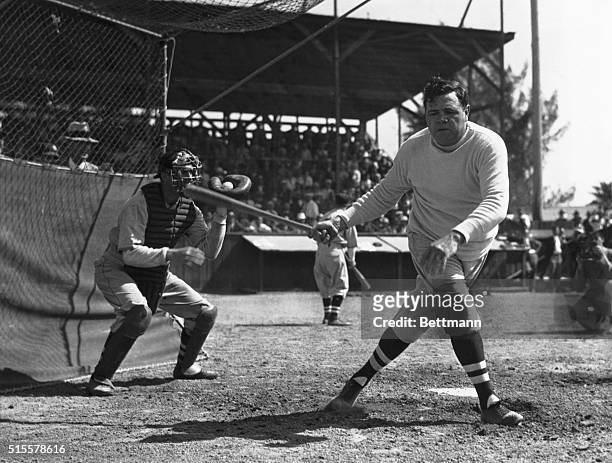 Saint Petersburg, FL: Babe Ruth up at bat misses the ball during Spring training.