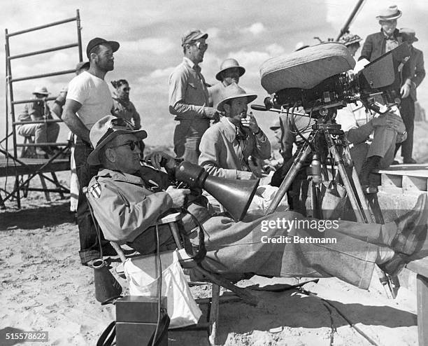 John Ford filming "My Darling Clementine", Monument Valley, Arizona. Undated b/w photograph.