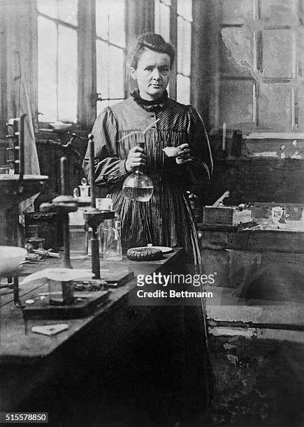 Madame Curie , noted physical chemist, poses in her Paris laboratory. Undated photograph.