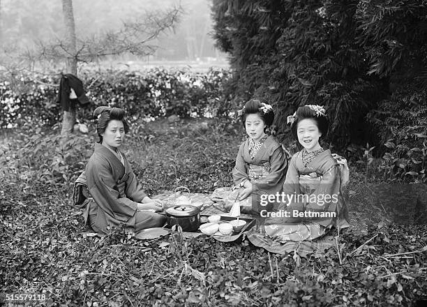 Geisha girls photographed out of doors. Japan. Undated.