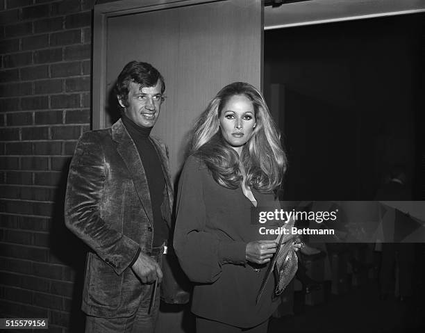 Ursula Andress and Jean-Paul Belmondo arrive for the invitational preview of the movie 'Midnight Cowboy', 3rd June 1969.