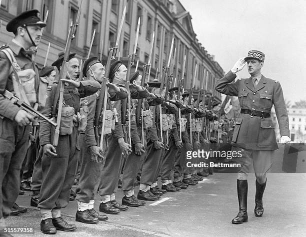 General Charles De Gaulle reviewing free French commando unit during Bastille Day in London, 1942.