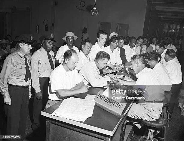 New York, NY: Last day rush for GI bill educational courses at New York regional office Veterans Administration- 252 7th Avenue. Photo shows crowd of...