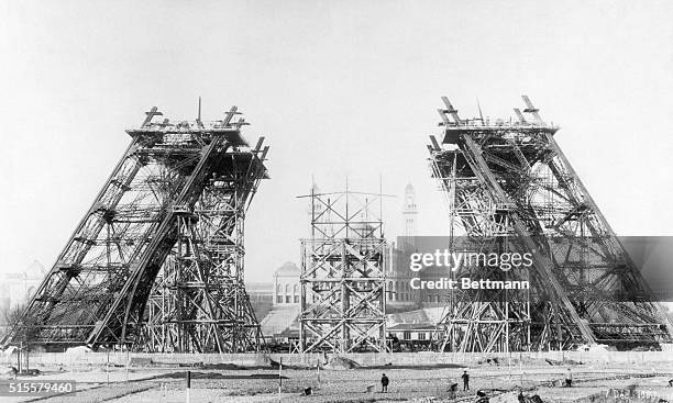 The four sloping legs of the Eiffel Tower undergo construction in 1887 at the Champ-de-Mars in Paris. Civil engineer Gustave Eiffel designed the...