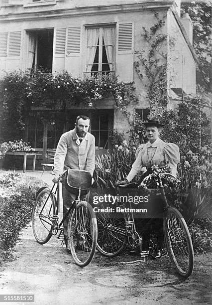 Physicist Pierre Curie and his wife chemist Marie Curie go for a bicycle ride.