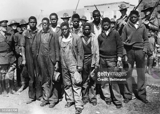 Fearing a mob lynching, Alabama Governor B M Miller called the National Guard to the Scottsboro jail to protect the young black men who are accused...