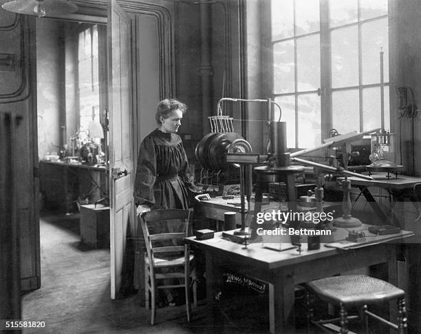 Madame Curie in her laboratory ca. 1905. From a rare photograph.