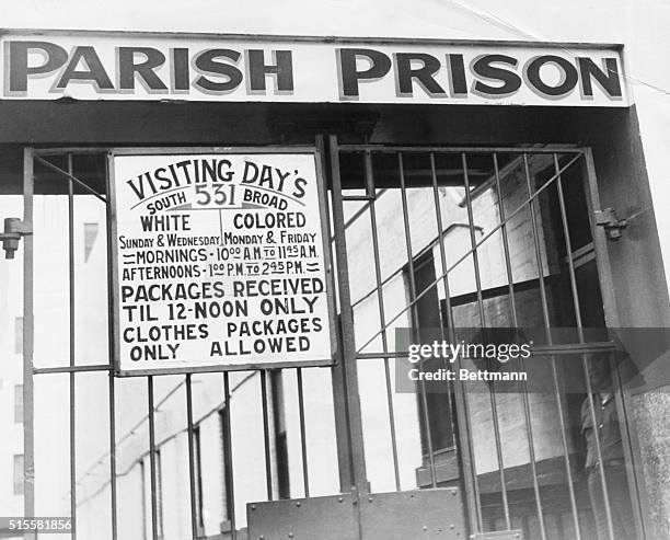 New Orleans, LA: Entrance to New Orleans Parish Prison, showing segregated visiting periods. Undated photograph.