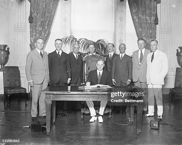 Washington, DC:A view of the ceremony in the East Room of the White House as President Hoover signed the instrument of ratification of the London...