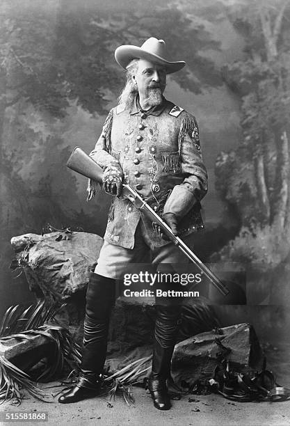 Full figure of William Cody with gun. Undated B/W photograph.