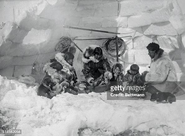 Family of Eskimos in Igloo
