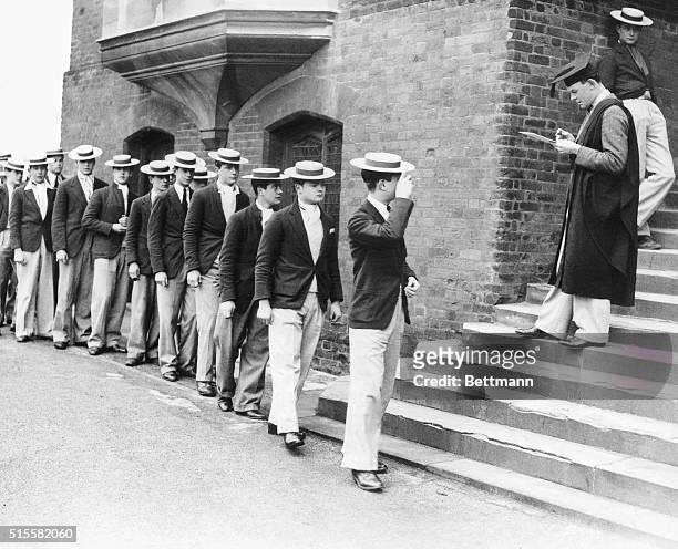 England: Founder's Day at Harrow School, England. Roll call. Students file past master. Undated photograph. BPA2# 1281