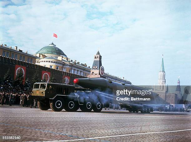 Soviet ballistic missile rolls by the Kremlin during a parade celebrating the 50th anniversary of the Bolshevik Revolution.