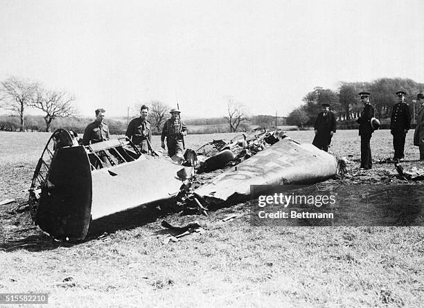 Home Guard soldiers stand near the wreckage of the Messerschmitt 110 fighter plane in which Rudolf Hess flew 830 miles from Germany to Scotland.