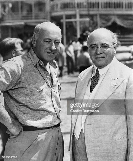 Los Angeles, CA: Cecil B. DeMille, movie director, entertained Albert Sarraut, former French Premier, on the set at the Paramount Studios, recently....