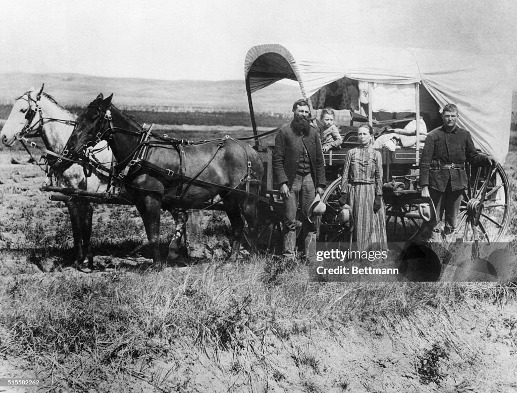 Emigrants Moving with Covered Wagon