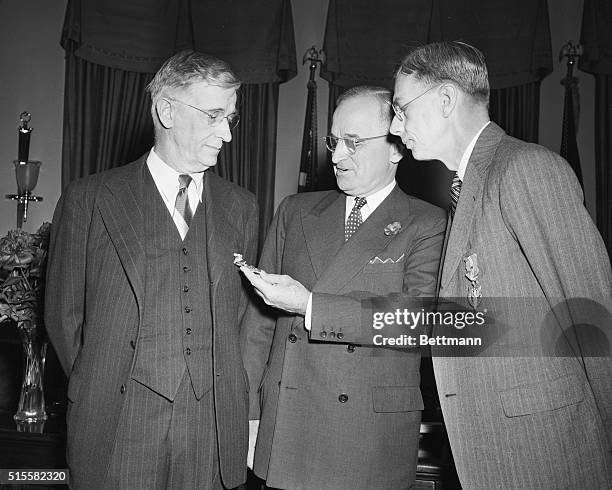 Washington, DC: In a ceremony at the White House here today, President Truman presented the medal for Merit and Bronze Oak Leaf cluster to Dr. James...