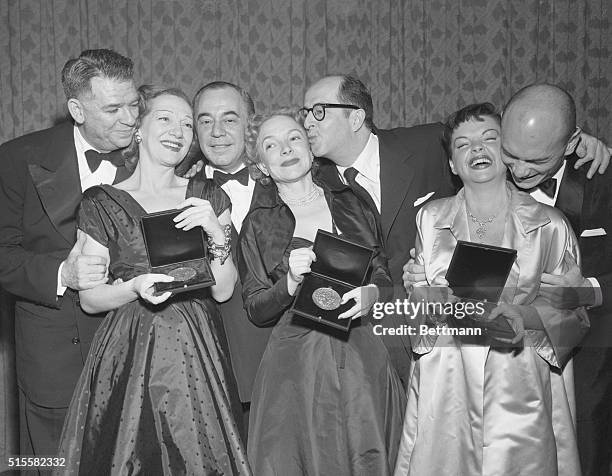 Tony winners pose for a photograph; Oscar Hammerstein, Gertrude Lawrence and Richard Rodgers of The King and I, and the host of the Awards, Helen...