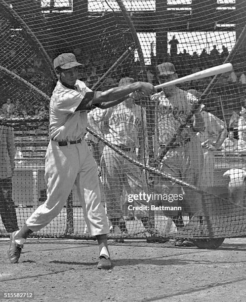 Chicago Cubs shortstop Ernie Banks swings his bat in batting practice in the batting cage at Ebbets Field in Brooklyn, New York. August 25, 1955.