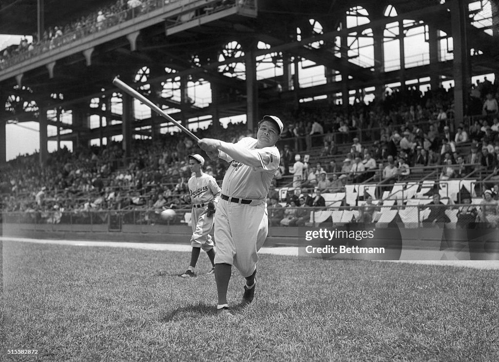 Babe Ruth Breaking Bat Babe Ruth, seen here as a coach for the Brooklyn Dodgers, swings the ...
