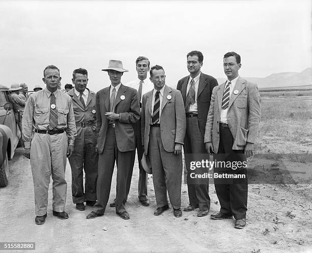 At a nuclear test site near Alamogordo, New Mexico, atomic bomb scientists measure radioactivity in seared sand particles 2 months after the...