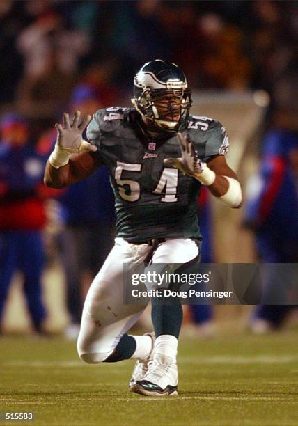 Jeremiah Trotter of the Philadelphia Eagles celebrates his third quarter sack of Kery Collins of the New York Giants for a nine yard loss as the...