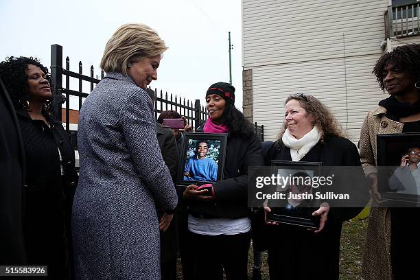 Democratic presidential candidate Hillary Clinton greets mothers who lost children to gun violence during a visit to the Kids Off the Block memorial...