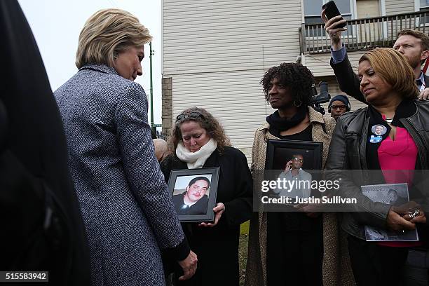 Democratic presidential candidate Hillary Clinton greets mothers who lost children to gun violence during a visit to the Kids Off the Block memorial...