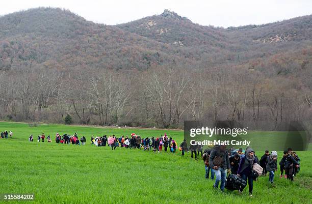 Migrants trek towards Macedonia after leaving the Idomeni refugee camp on March 13, 2016 in Idomeni, Greece. The decision by Macedonia to close its...