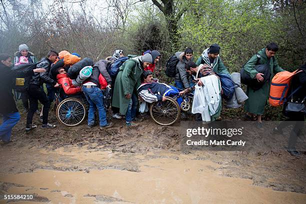 Migrants trek towards Macedonia after leaving the Idomeni refugee camp on March 13, 2016 in Idomeni, Greece. The decision by Macedonia to close its...