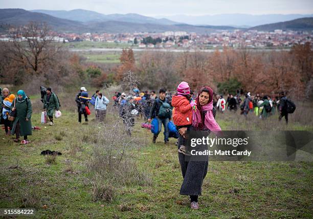 Migrants trek towards Macedonia after leaving the Idomeni refugee camp on March 13, 2016 in Idomeni, Greece. The decision by Macedonia to close its...