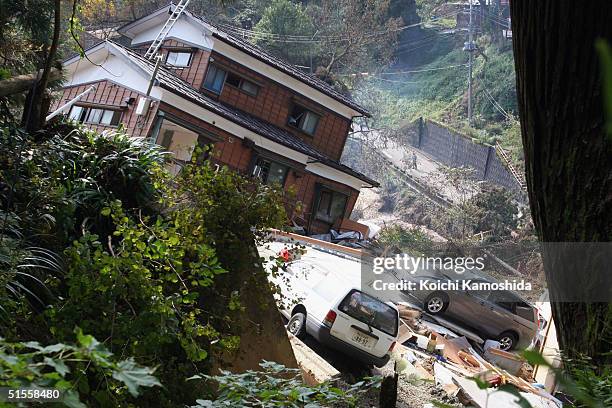 Damaged house sits precariously as earthquke aftershocks continue on October 25, 2004 in Nagaoka, Japan. A series of powerful earthquakes rocked...