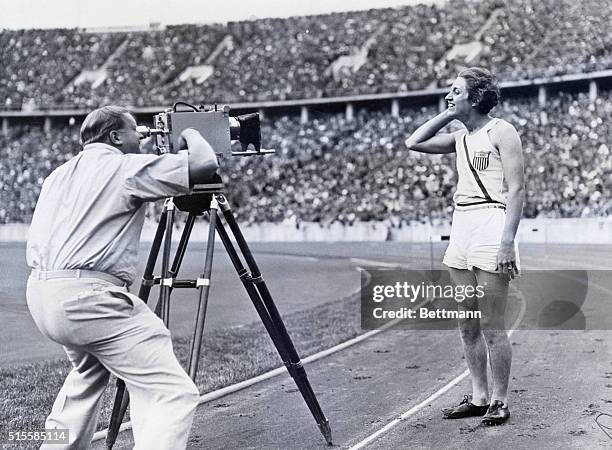 Berlin, Germany: Helen Stephens, of Missouri, smiles for the camera man after setting a new world record of 0.11.5, in the 100 meter finals which she...