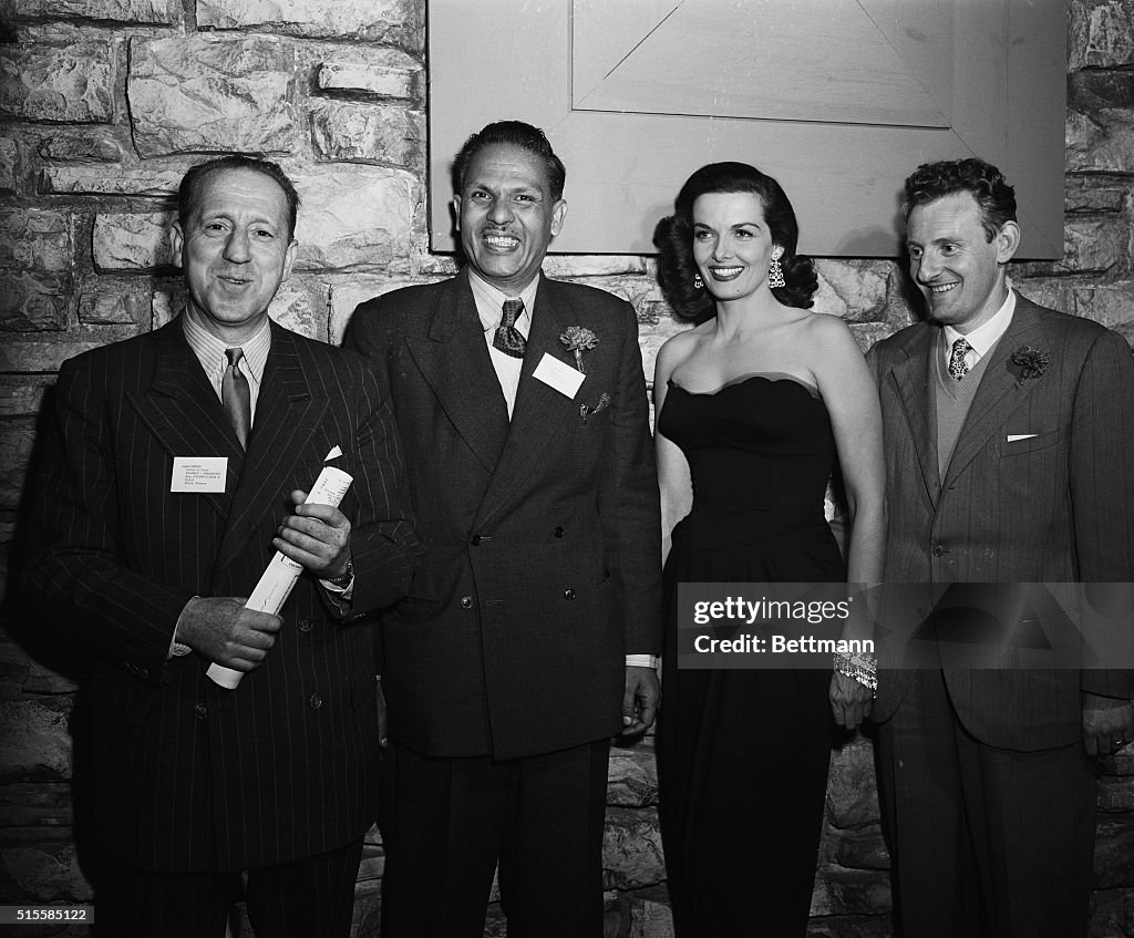 Jane Roussel Journalists and editors posing with movie actress Jane Russell on the ...