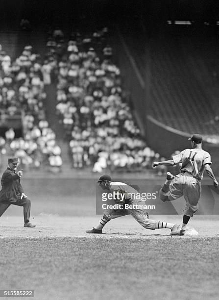 Polo Grounds, NY: Chicago Cubs shortstop Bill Jurges tried hard to beat out his grounder to Dick Bartell in the second inning of the Giants-Cubs game...