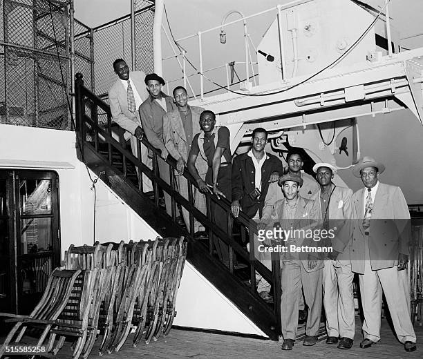 New York, NY: Members of the Globetrotters basketball team are shown arriving in New York aboard the liner Mauretania. From top to bottom are: Louis...