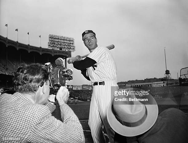 New York Yankee baseball player Joe DiMaggio poses for photographers before the World Series against the Philadelphia Phillies at Yankee Stadium.