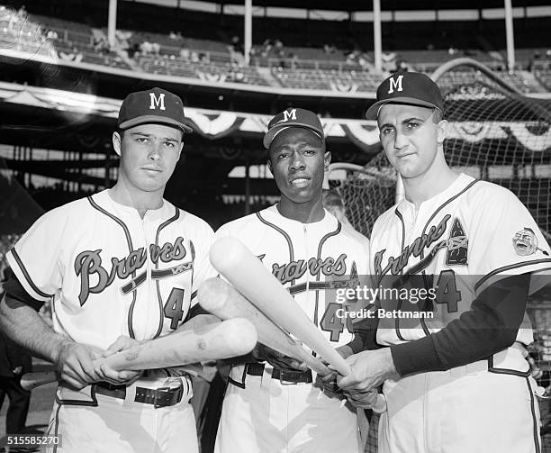 Milwaukee, WI: The three musclemen of the Milwaukee Braves pose before the fifth game of the World Series against the Yankees, determined to perform...