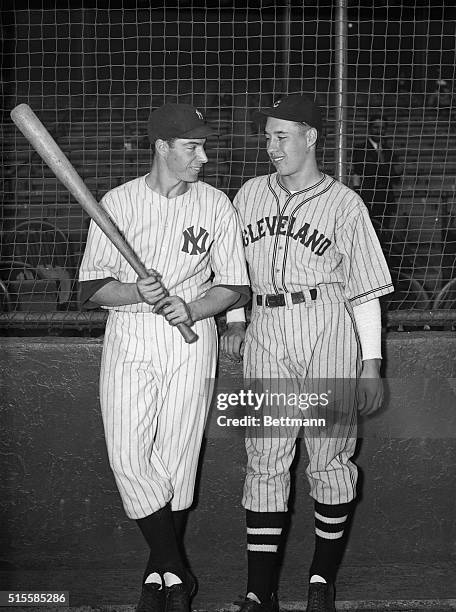 Joe DiMaggio ,the New York Yankees' sensational rookie outfielder who is among the American League's leading batters,seems to be teling Bob Feller...