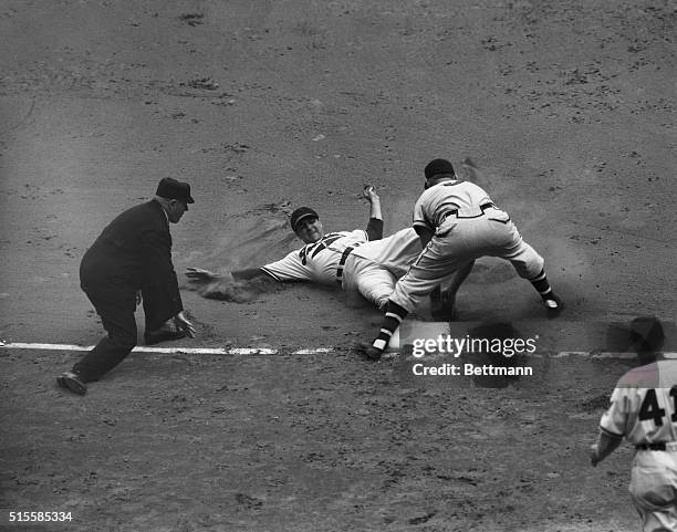 Cleveland, OH: Bob Elliott puts the ball on Lou Boudreau, as the Cleveland Indian manager was out trying to stretch his first-inning double. The hit...