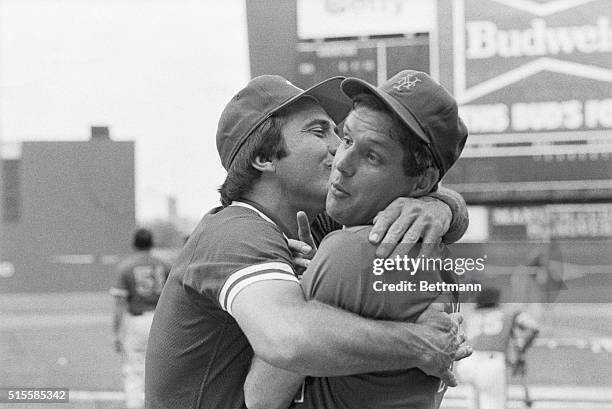 New York, NY: Mets' Tom Seaver is very surprised as Reds' Johnny Bench grabs and kisses him after overhearing all the nice things that Seaver was...