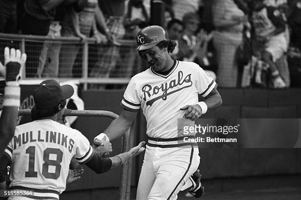 Kansas City, MO: Kansas City's incomparable George Brett is congratulated by teammates after a 7th inning homerun that helped whip the New York...